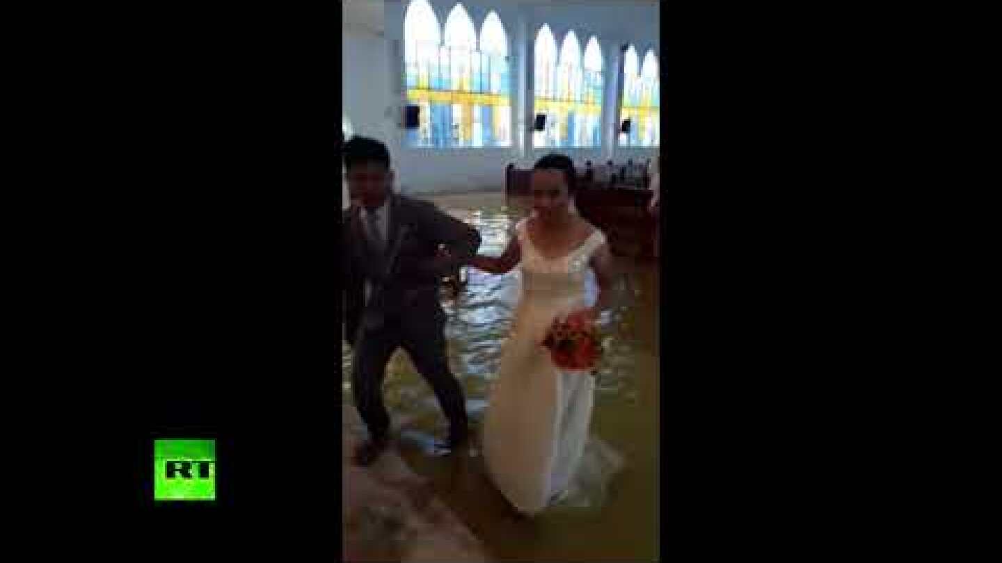 Wet Wedding: Couple marry despite flooded church as heavy rains batter Philippines