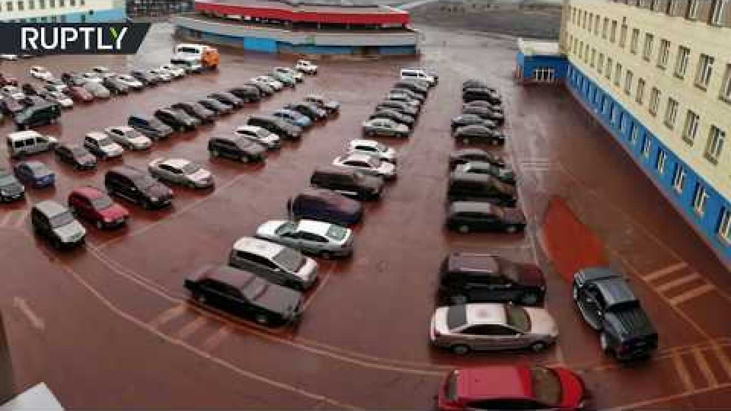 Siberia going biblical? ‘Blood rain’ pours down on Russian parking lot