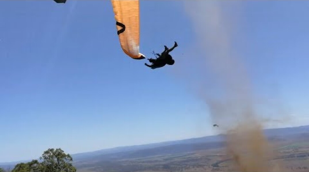 Dust devil sends paraglider flying