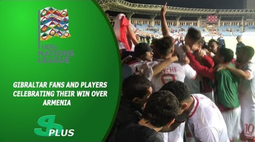 Gibraltar fans and players celebrating their win over Armenia