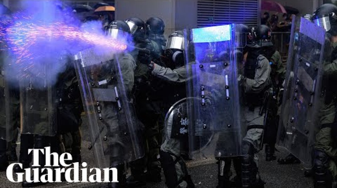 Police draw guns and deploy water cannon in clashes with Hong Kong protesters