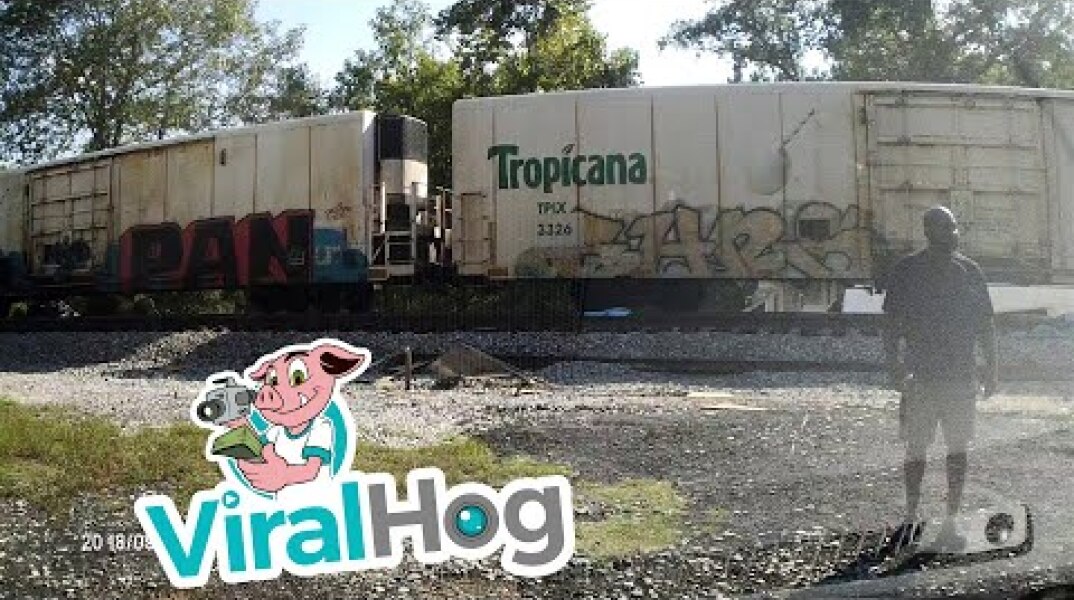 Semi-Trailer Sliced in Half by Freight Train || ViralHog