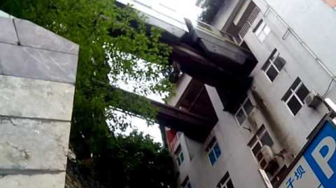 Chongqing, China, Train runs into building's 5th floor.
