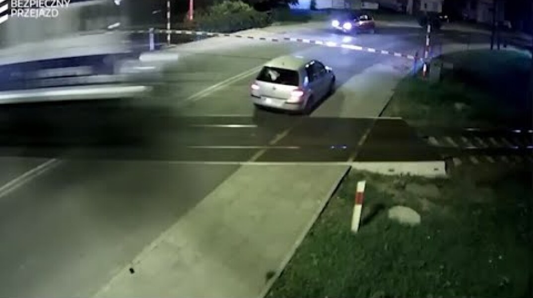 Raw: Vehicle Has Near Miss at Polish RR Crossing