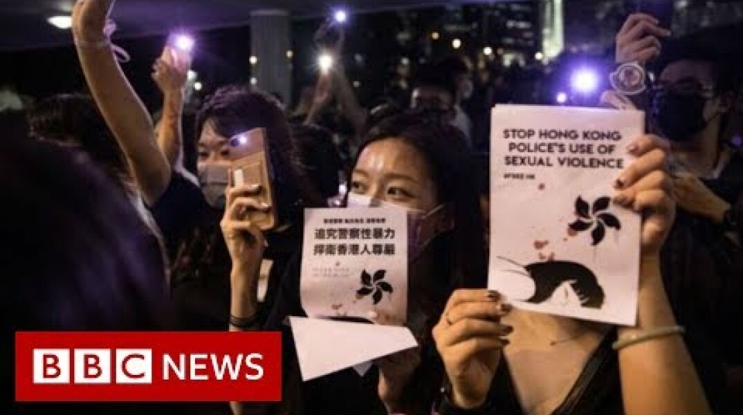 Hong Kong park lights up in sex abuse protest - BBC News