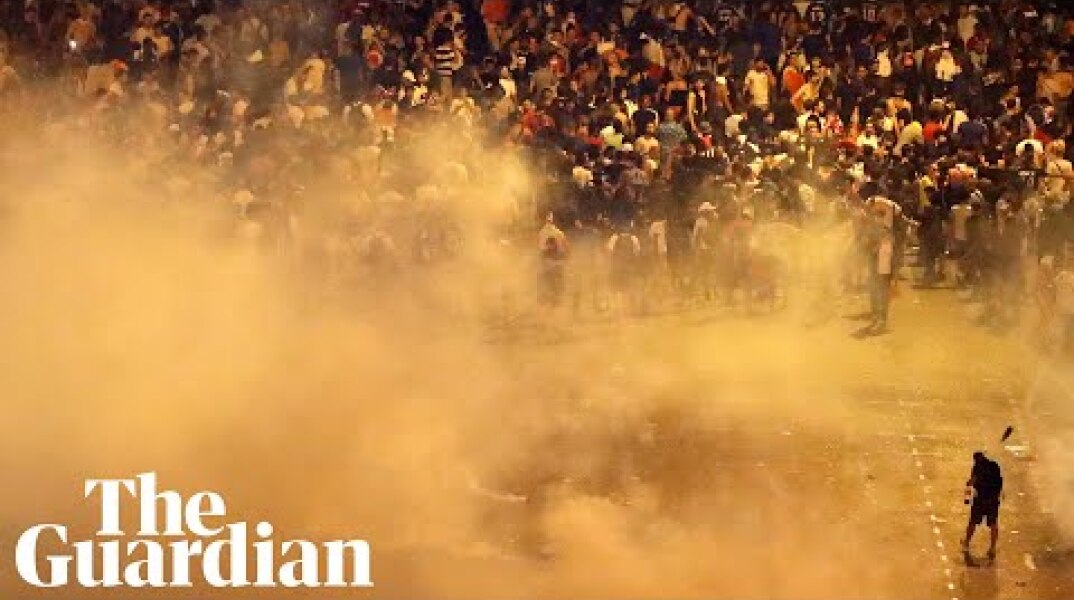 Police and football fans clash in Paris after France's World Cup victory