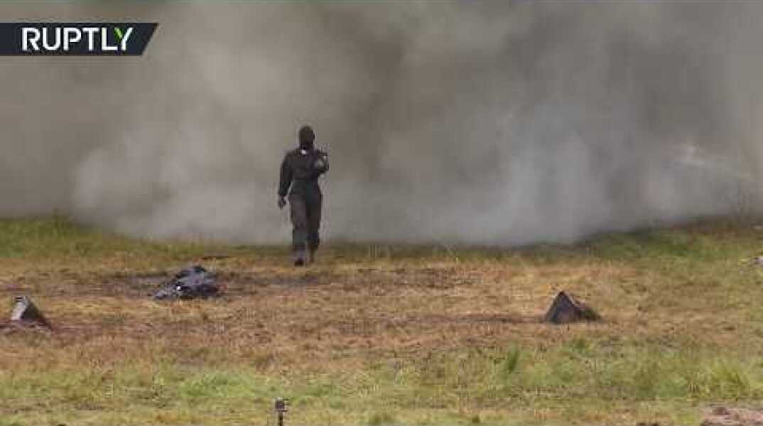 Russian Superwoman: Outrageous walk through explosions & fire to test armor suit