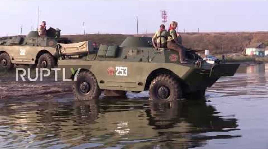 Russia: Dolphins spotted as amphibious APCs cross Kerch Strait in historic re-enactment