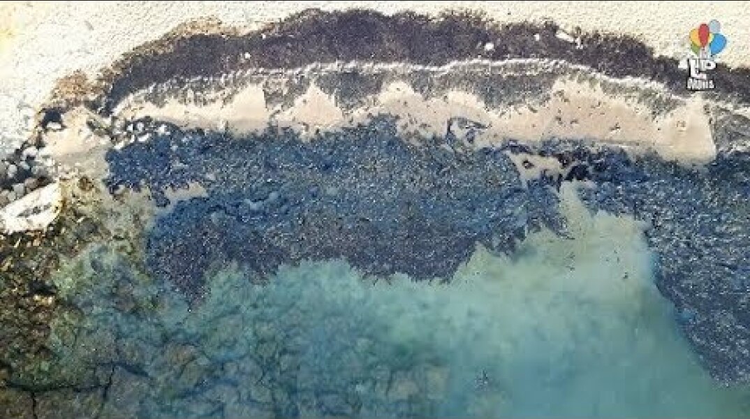 The environmental disaster from the oil accident in Salamis Greece from above. Drone footage.