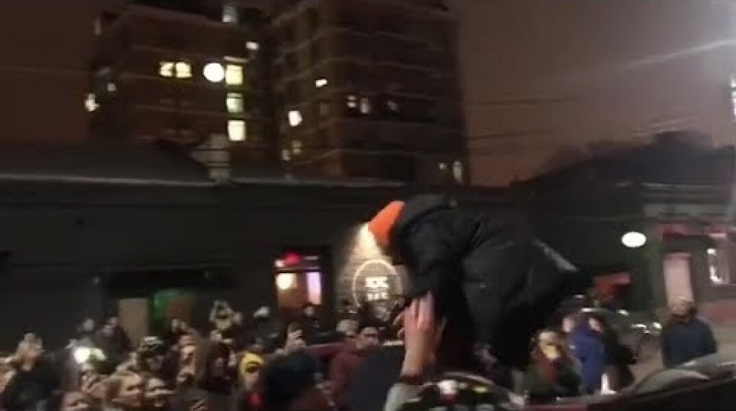 Moment Russian rapper Husky is arrested after impromptu gig on roof of car - video