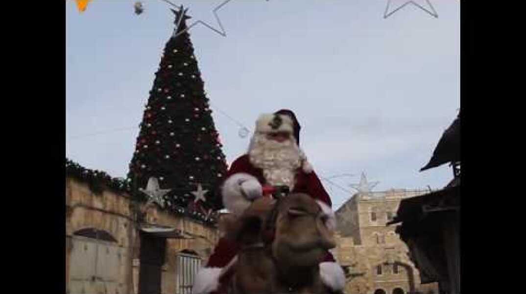 Palestinian Christian Issa Kassissieh Plays Santa in Jerusalem