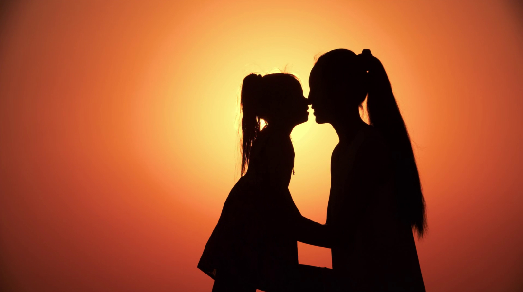 silhouette-of-mother-and-little-daughter-playing-at-sunset-slow-motion-close-up_bxs9p4sqr_thumbnail-full01.jpg