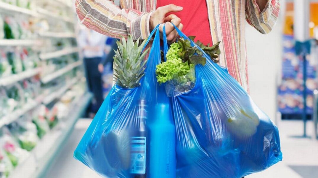 man-looking-at-bill-in-grocery-store.jpg