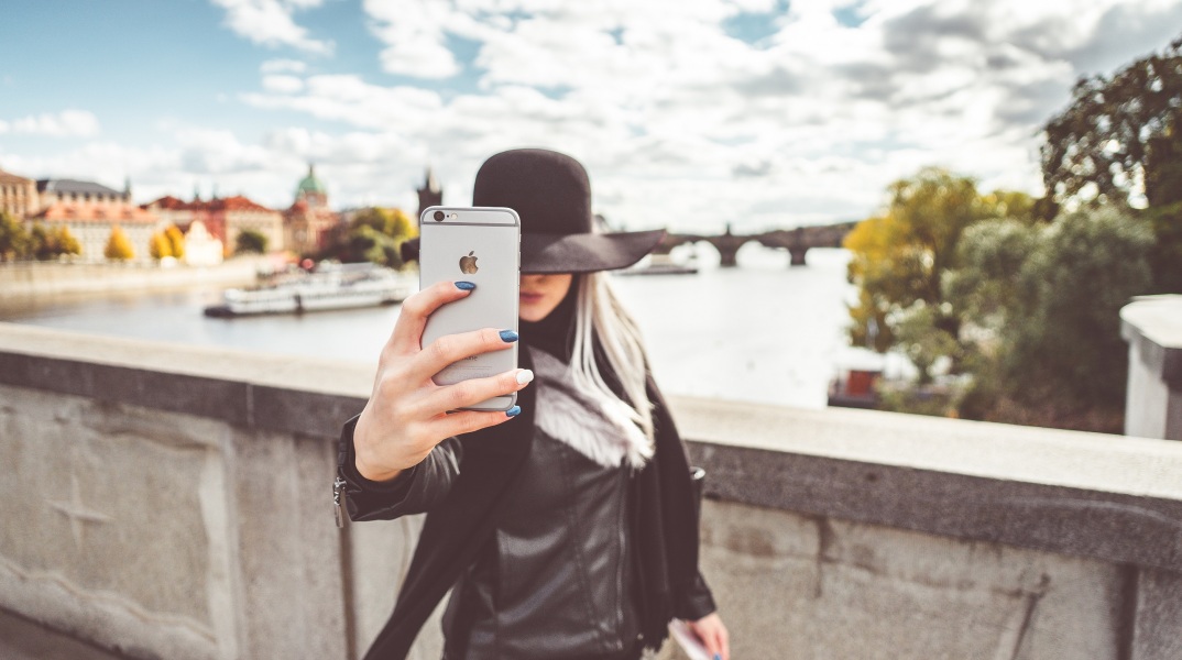 young-woman-taking-a-selfie-with-her-iphone-picjumbo-com.jpg