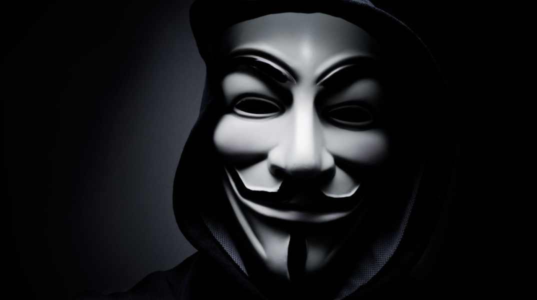 stock-photo-paris-france-january-man-wearing-vendetta-mask-this-mask-is-a-well-known-symbol-for-244924321.jpg