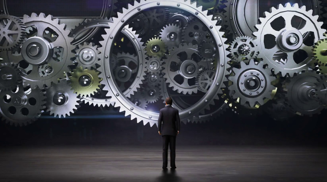 businessman-standing-big-gear-wheels-connecting-gear-wheels2_rcpcamkxx_thumbnail-full01.jpg