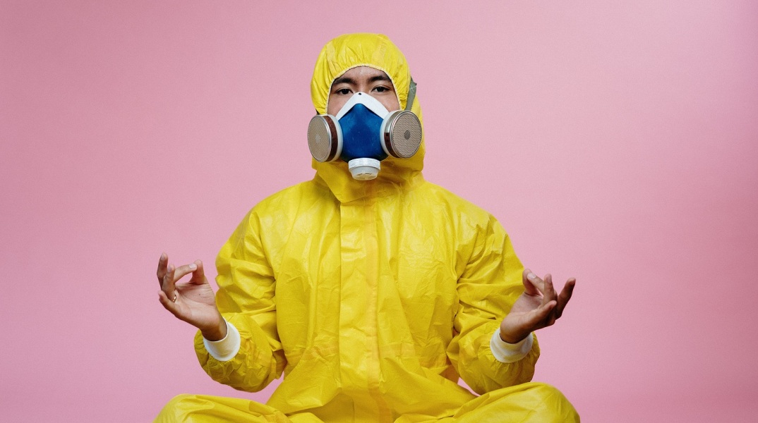 person-in-yellow-protective-suit-doing-a-yoga-pose-3951367.jpg