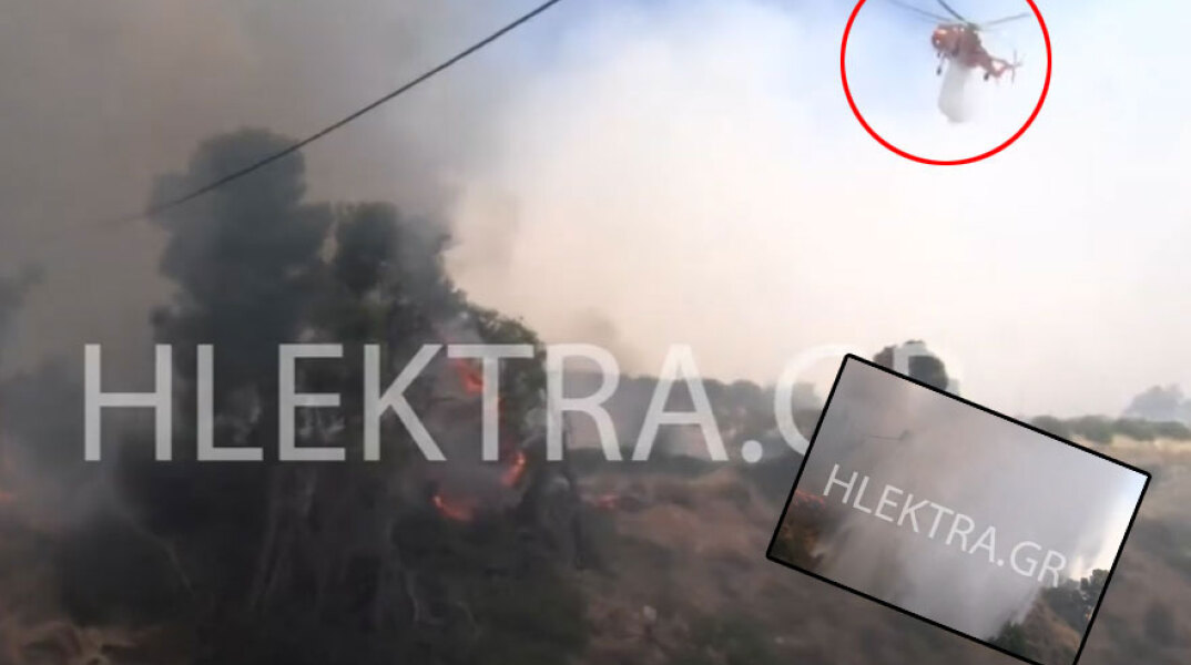 Η στιγμή που ρεπόρτερ στη φωτιά στις Κεχριές Κορινθίας γίνεται «μούσκεμα» από ελικόπτερο της Πυροσβεστικής