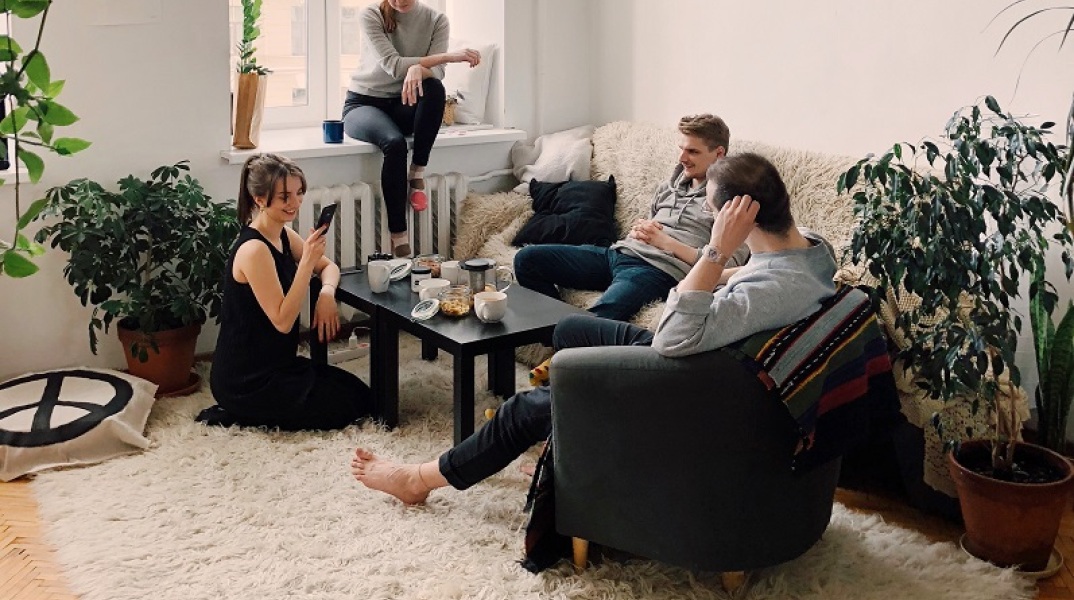 people-gathered-inside-house-sitting-on-sofa-1054974.jpg