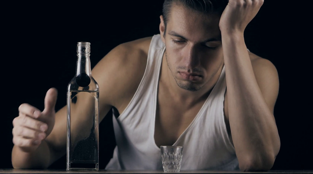depressed-man-drinking-vodka-in-a-dark-room_bcs6hvp1l_thumbnail-full01.png