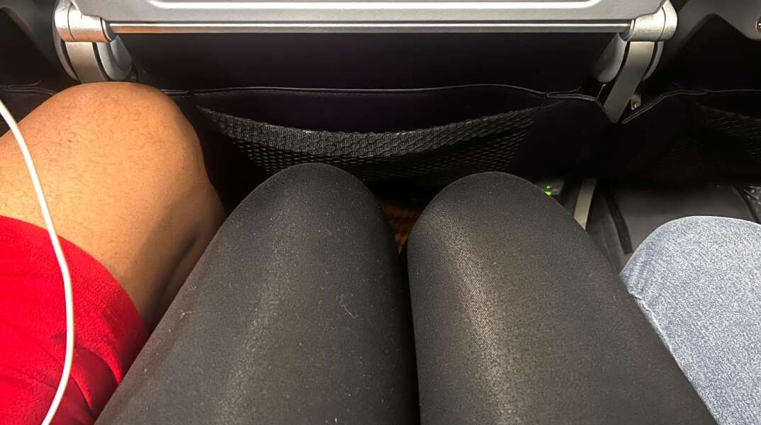 manspreading-on-plane-1-032726-e3fce996591a4ebdaae4b8beb69c5637