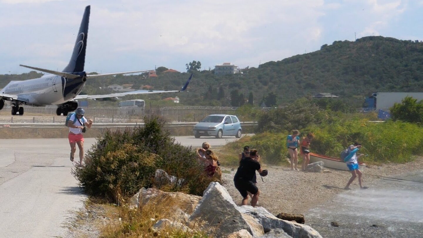 737 Jetblast Blows Onlooking Tourists into the Sea- Skiathos Airport