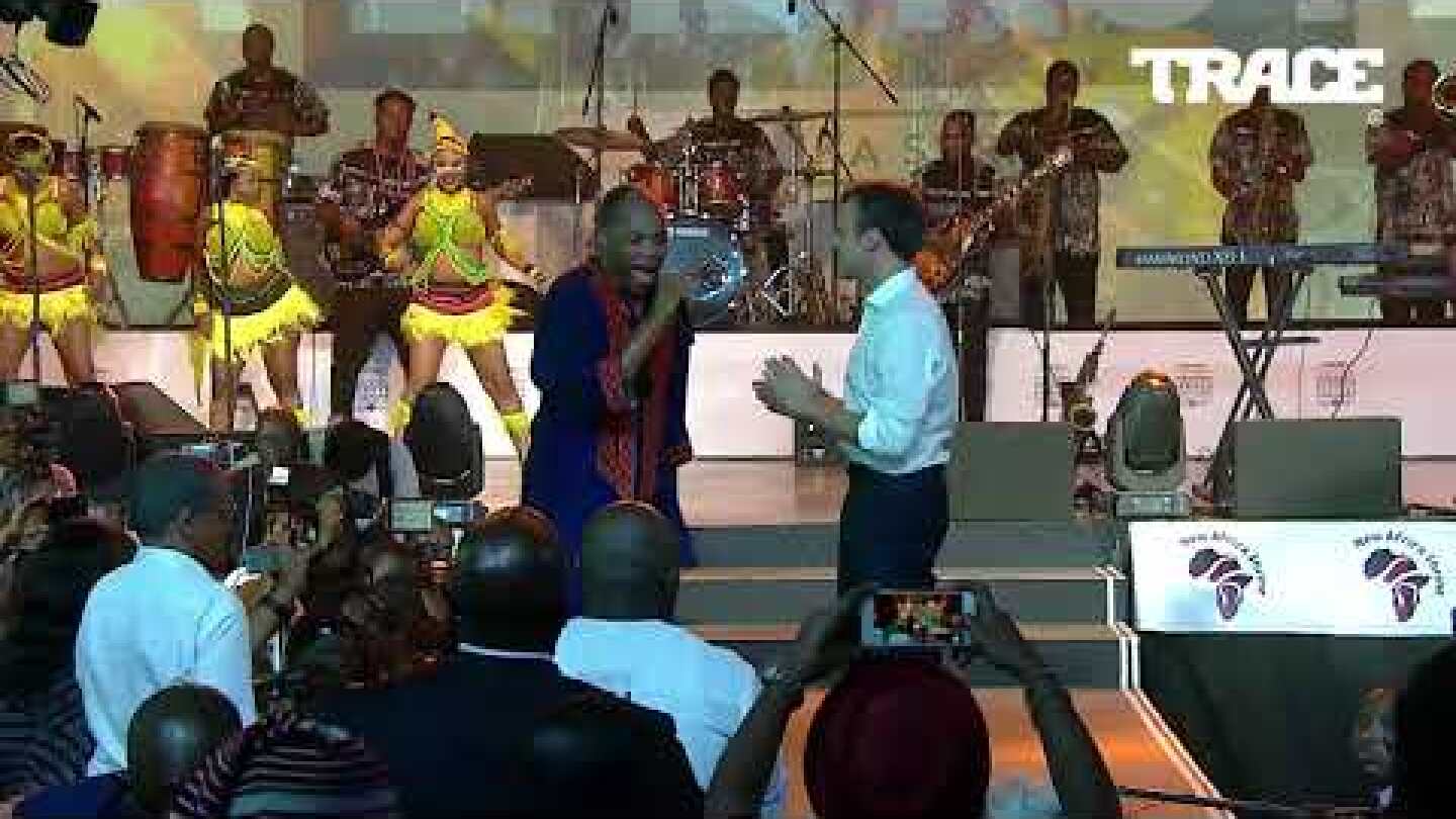 Femi Kuti dancing with president of France Emmanuel Macron