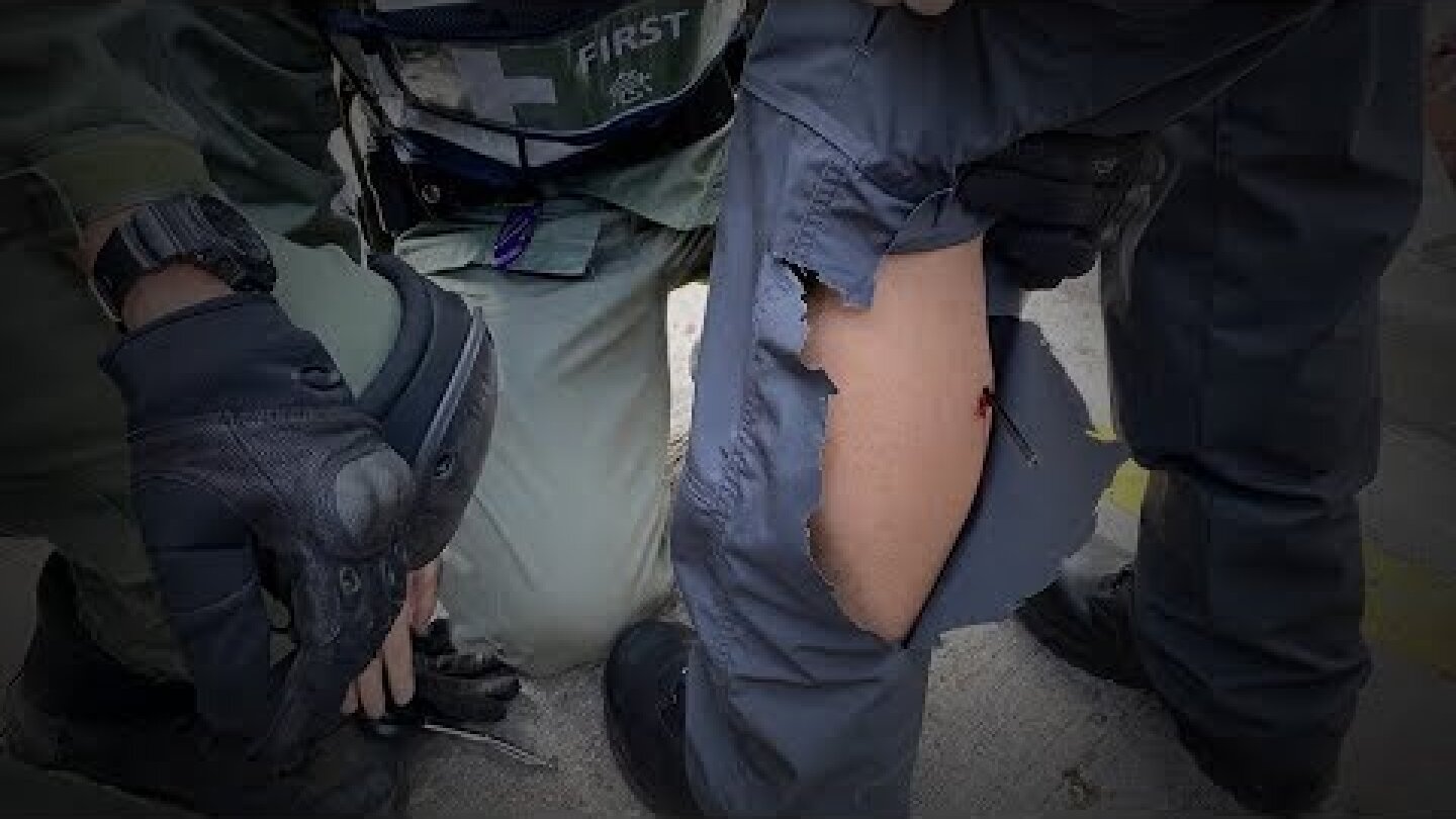 Hong Kong police officer shot by arrow