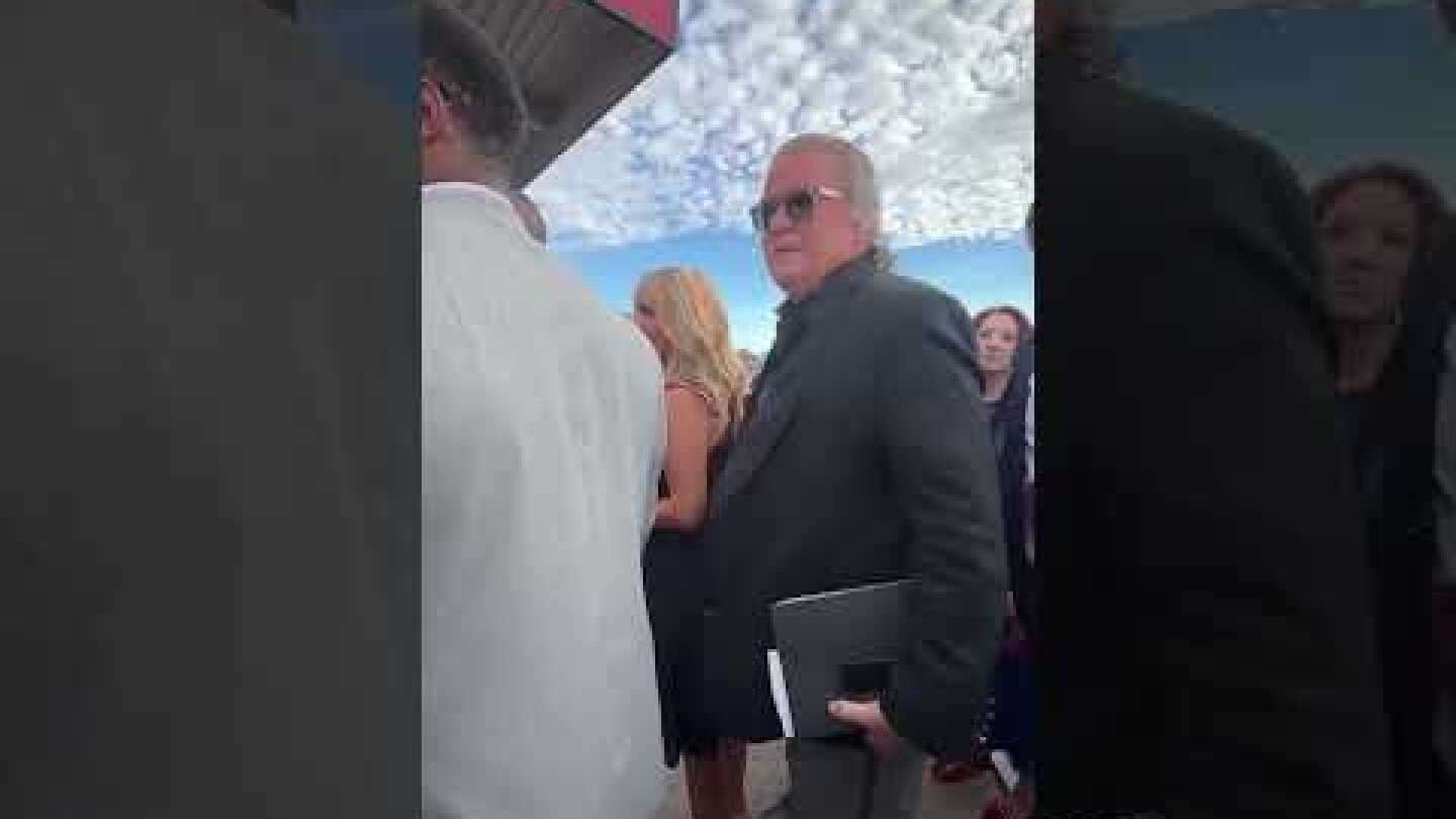 Steve Bannon makes his way inside State Farm Stadium for Charlie Kirk memorial services