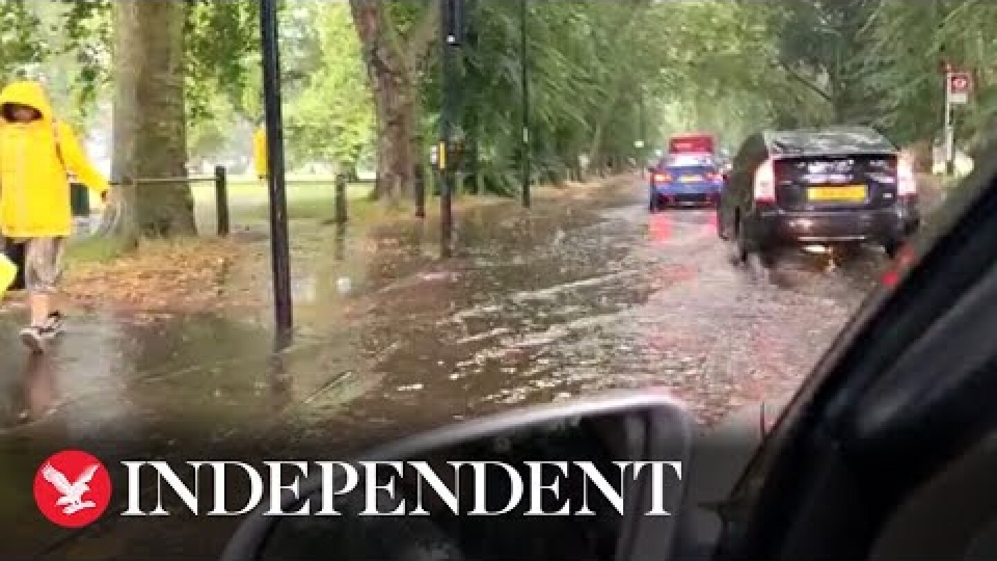 Heavy rains flood roads around London's Clapham Common