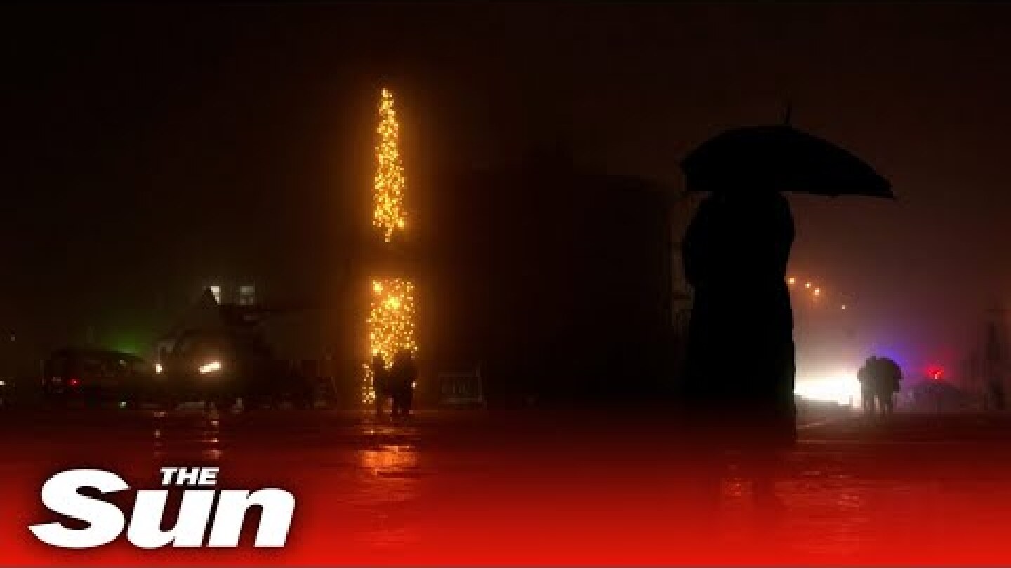 Ukrainians visit wartime Christmas tree installed in downtown Kyiv