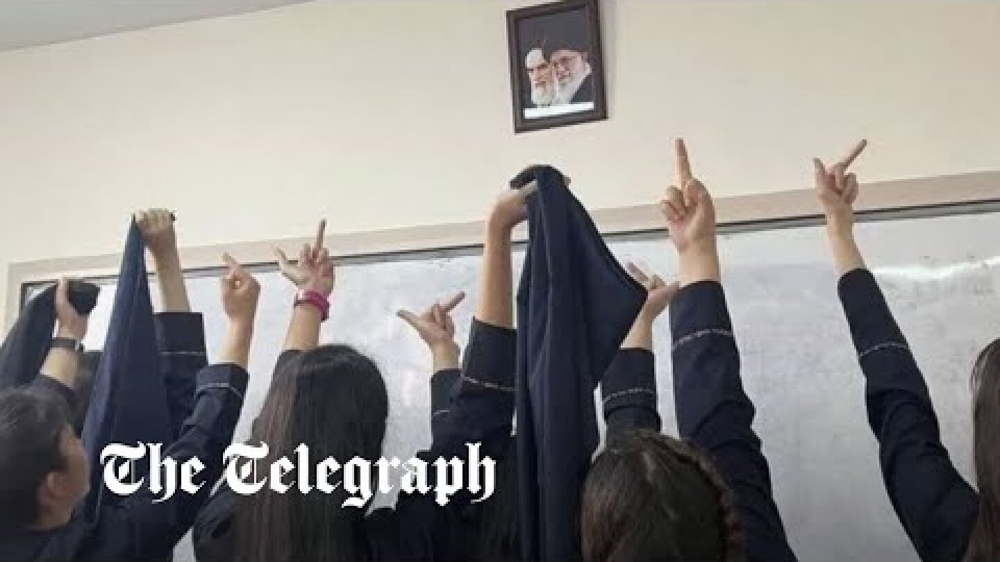 Iranian schoolgirls give clerical leaders the finger as they join uprising against the regime