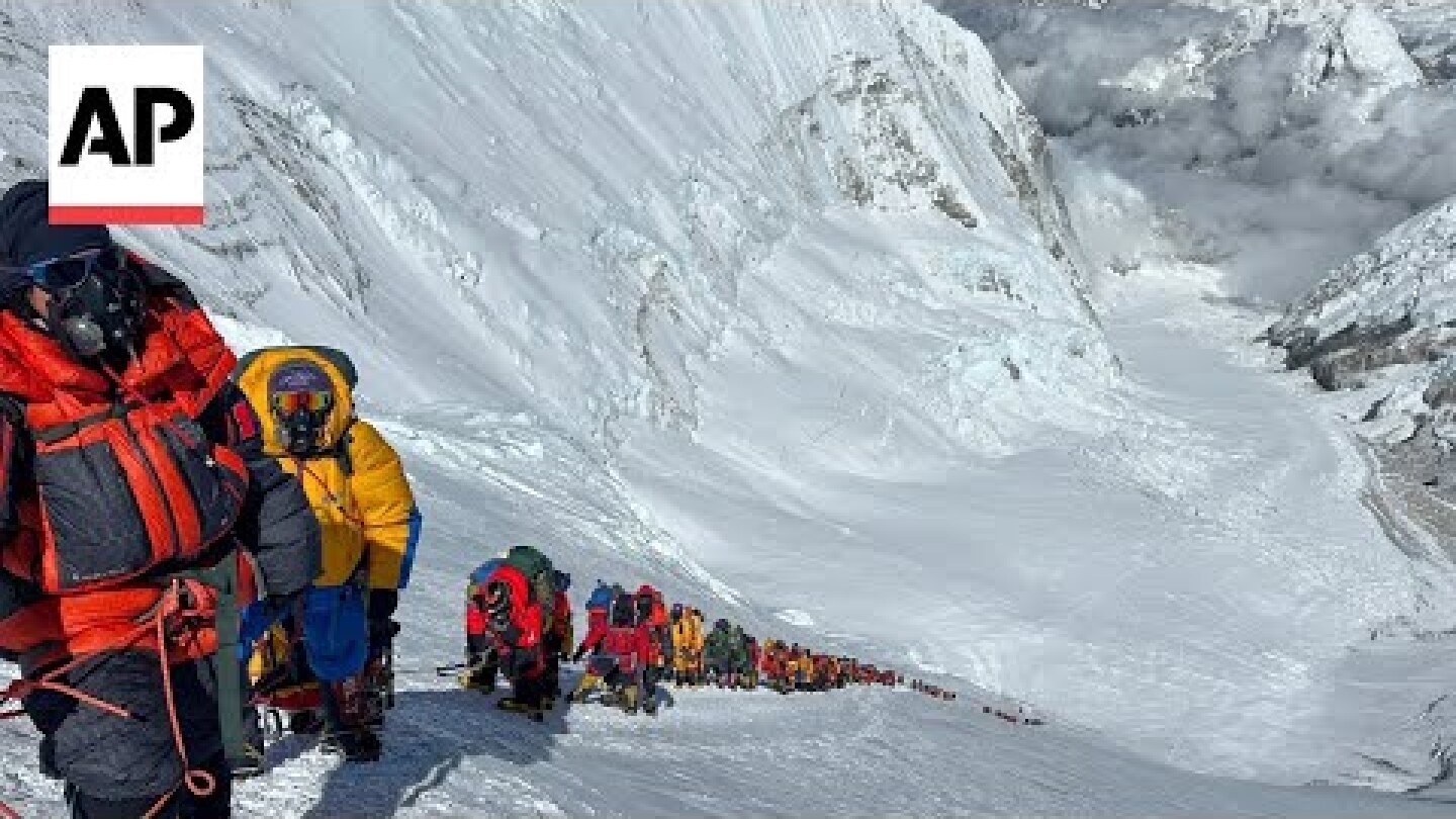 Hundreds scale Mount Everest in a weather-hit climbing season
