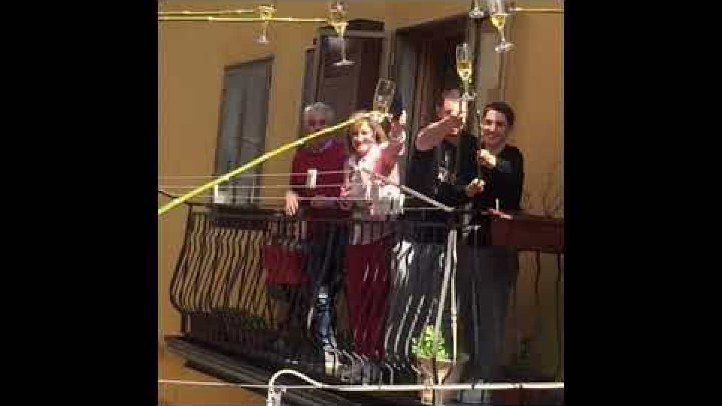 Cheers From a Distance: Italians Enjoy Drinks Together From Separate Balconies