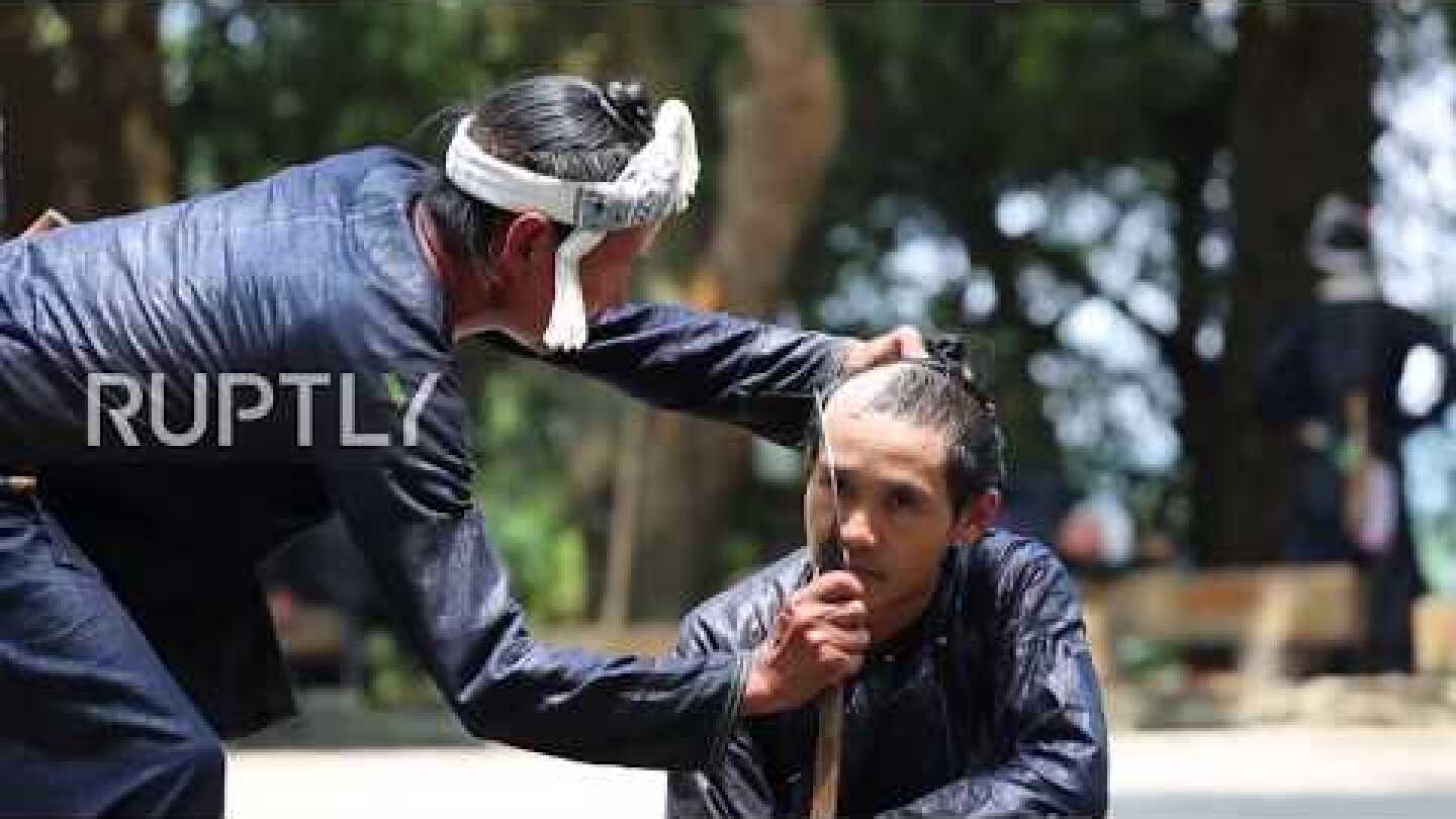 Chinese barber gives haircut with razor-sharp SICKLE