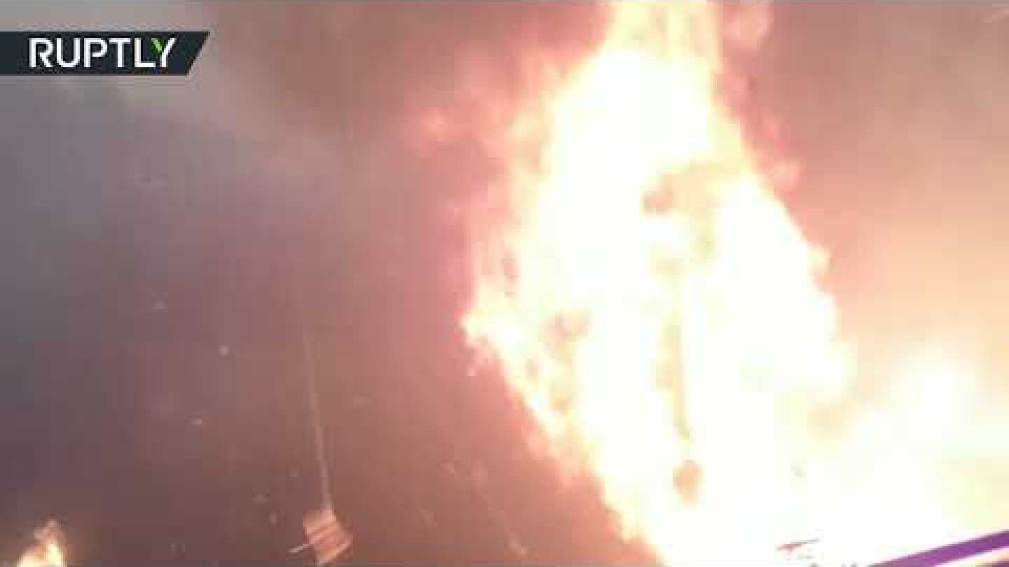 Please mind the fire: Train rushes through forest set ablaze in Russia's Far East