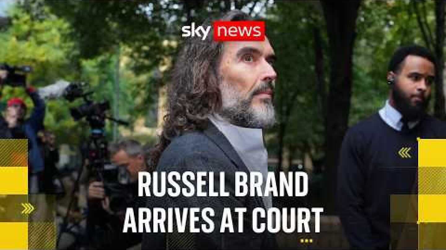 Russell Brand arrives at court ahead of trial