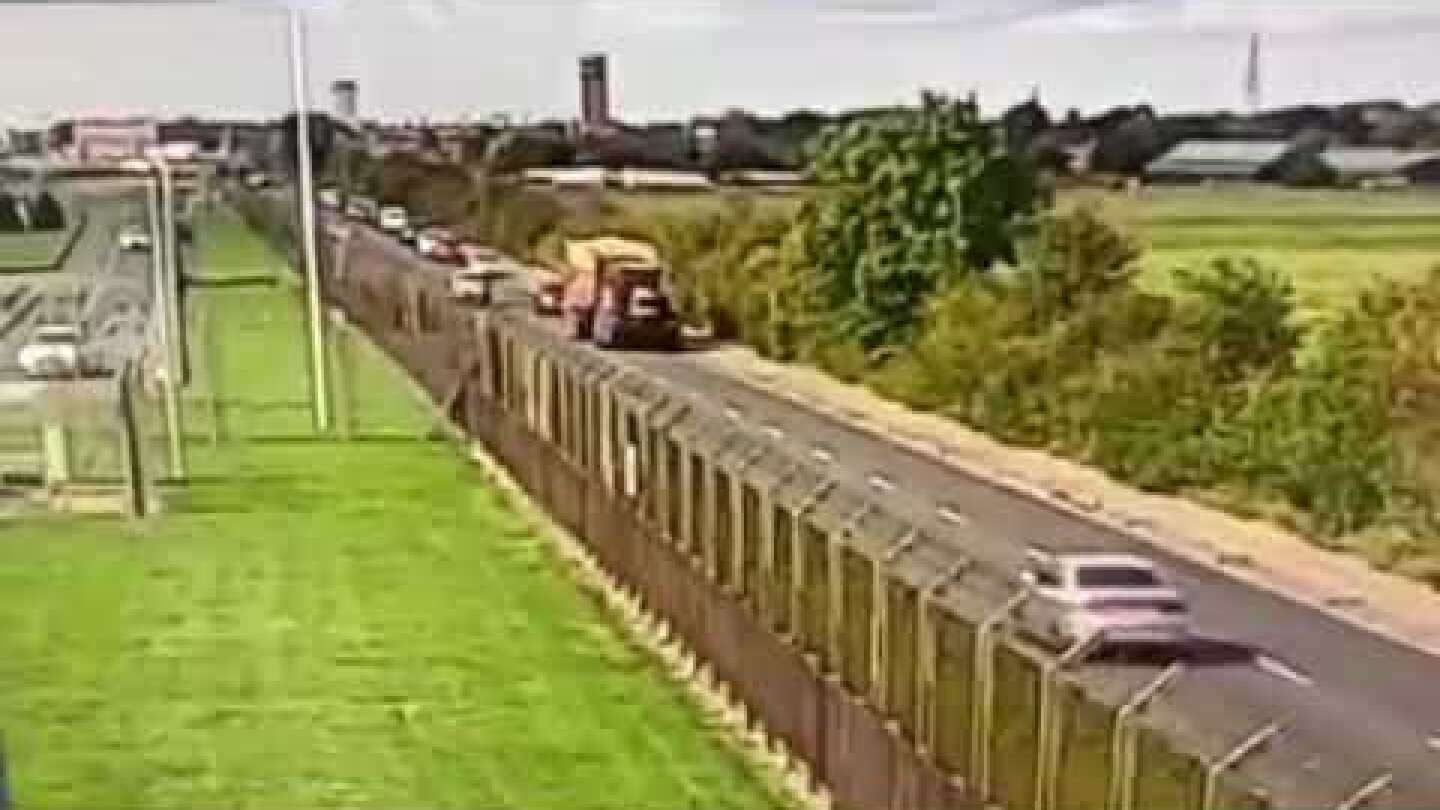 Tractor Flattens Car - Amazingly both drivers escaped serious injury..