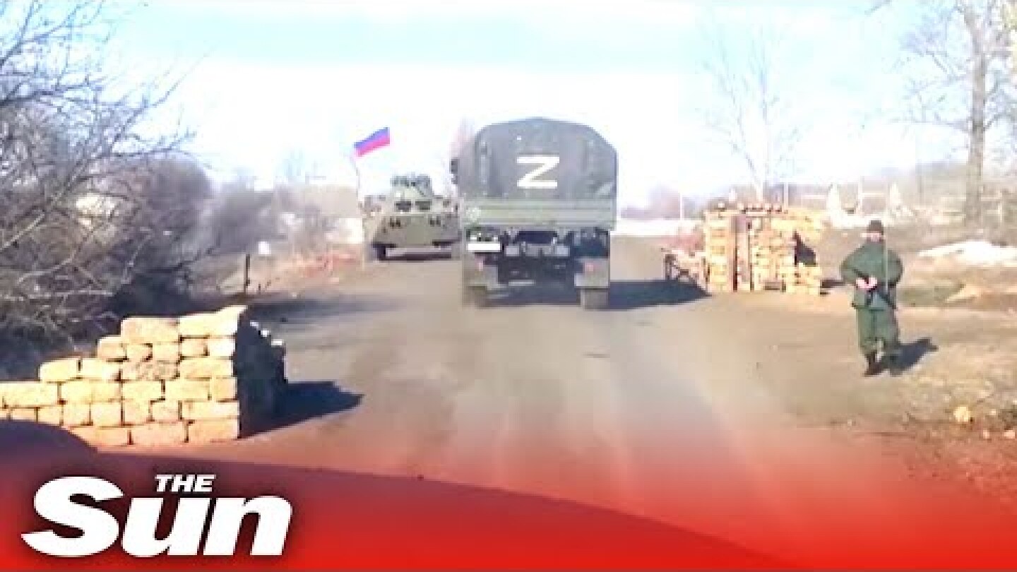 Russian military convoy moves through Kharkiv region, littered with destroyed tanks
