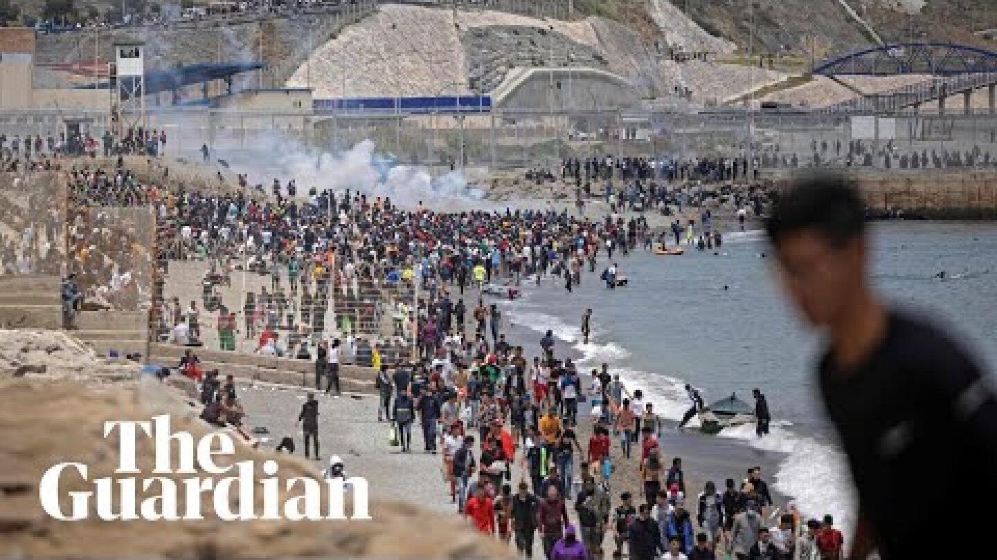 Migrants met by Spanish military as they swim to north African enclave Ceuta