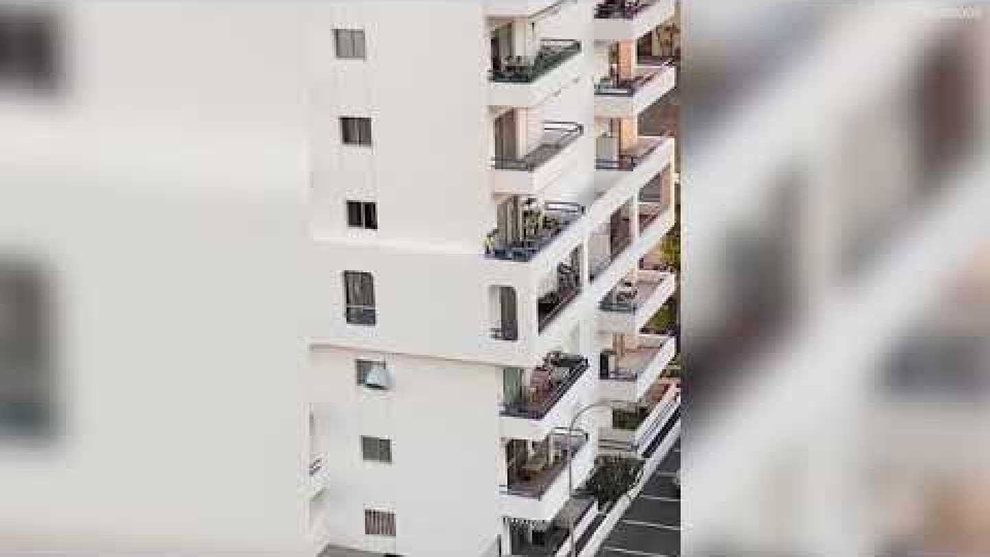 Toddler's death defying walk on tiny ledge around side of Tenerife tower block