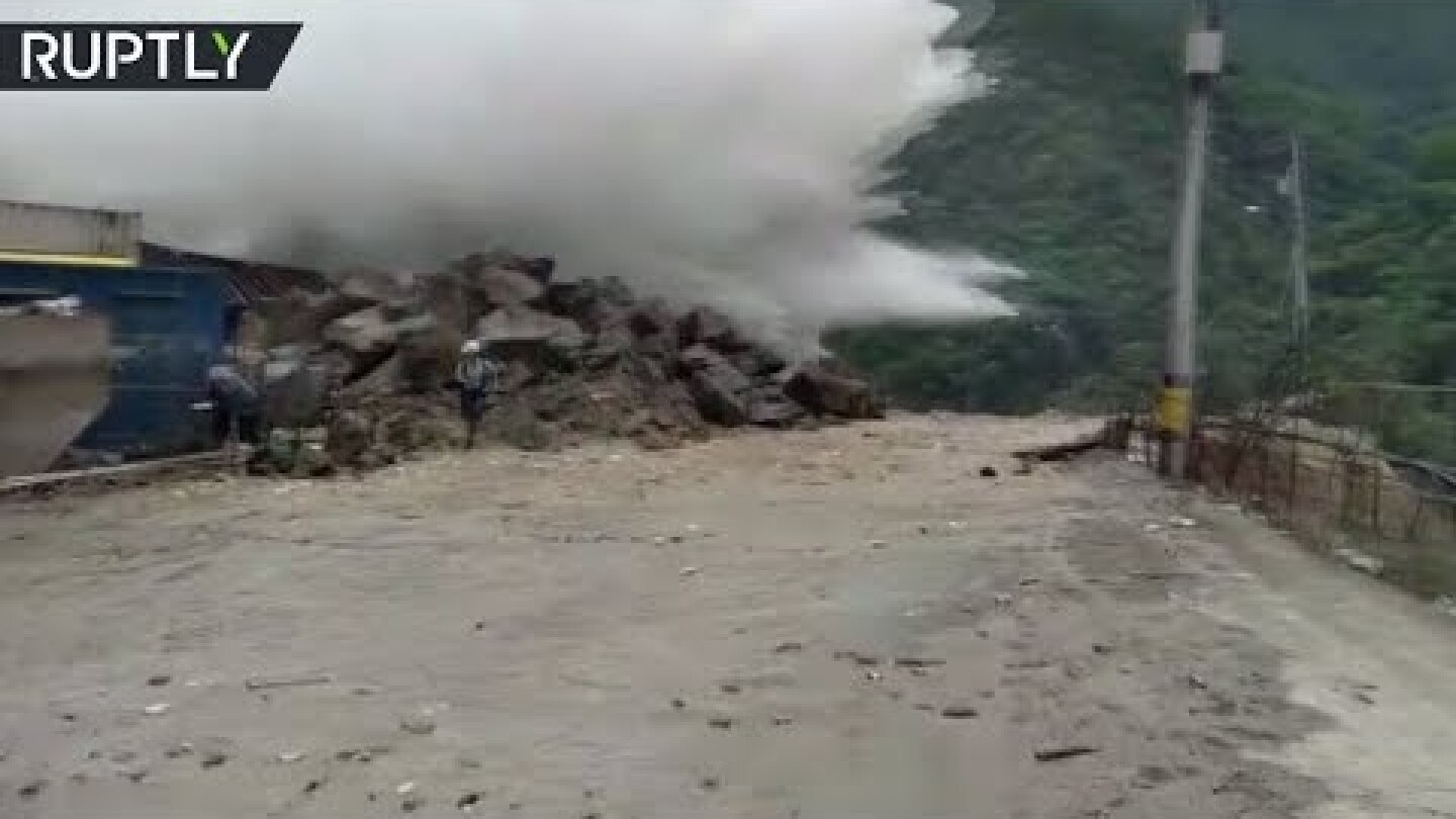 Close shave: Construction worker nearly hit by burst of water from flooded dam
