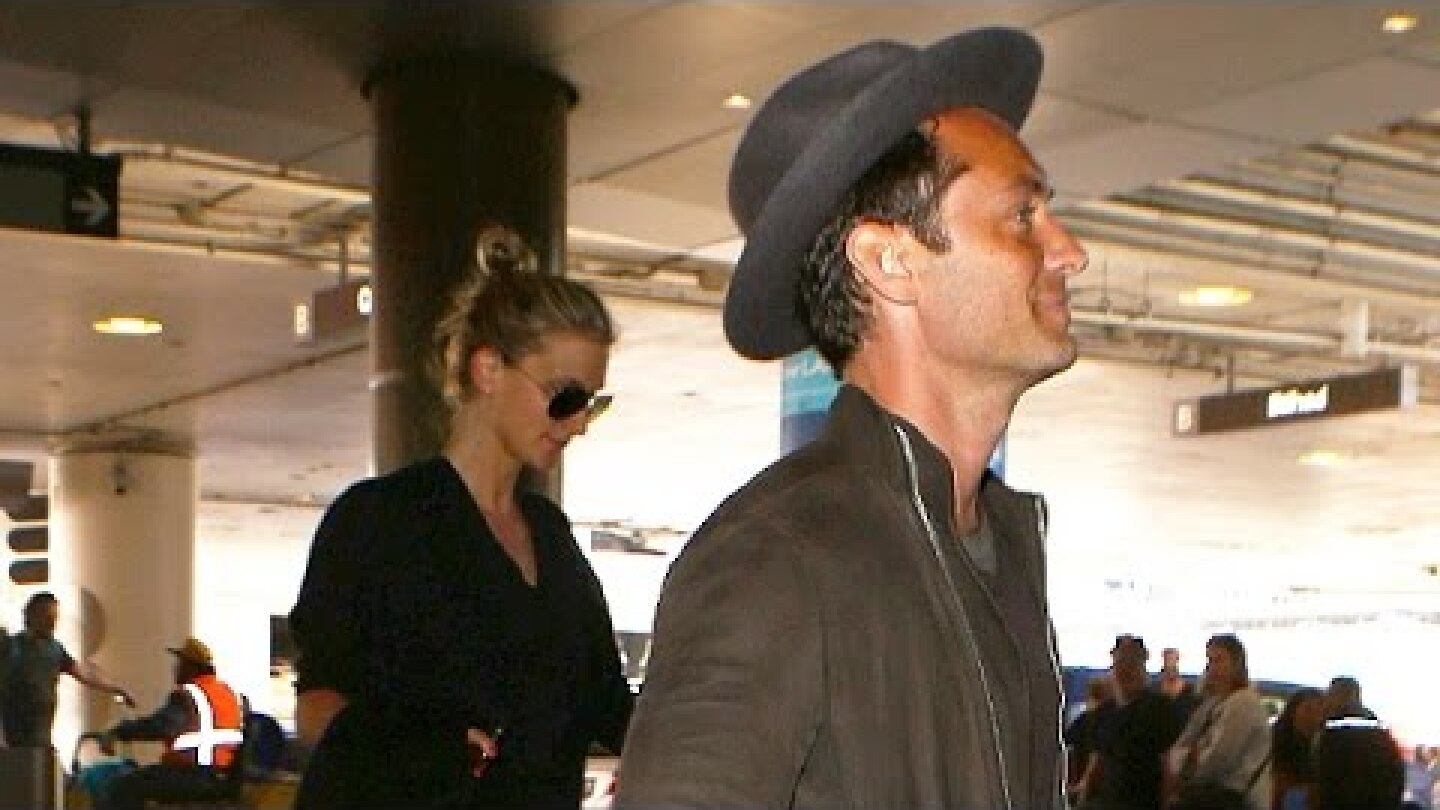 Jude Law And GF Phillipa Coan Arrive At LAX With The Top Down
