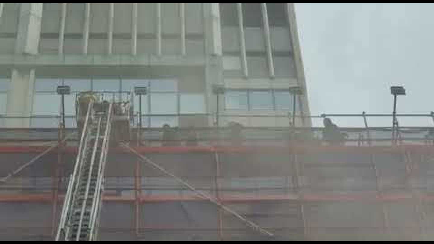Firemen rescue those trapped at the World Trade Centre Hong Kong in Causeway Bay