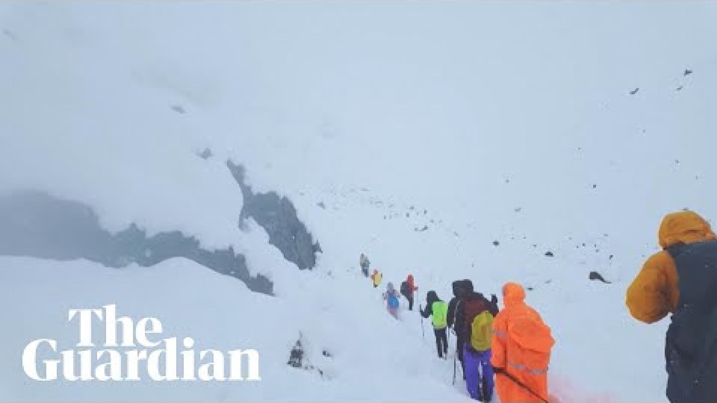 Eyewitness video captures hikers wading through snow after blizzard near Everest