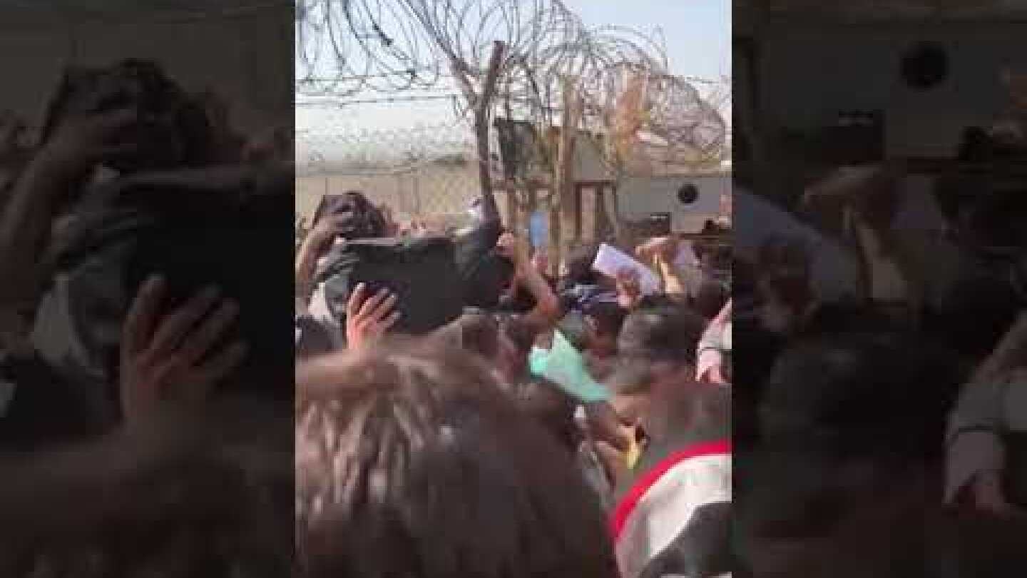 Women throw babies and little girls over razor wire at airport compound. #afghanistan #taliban