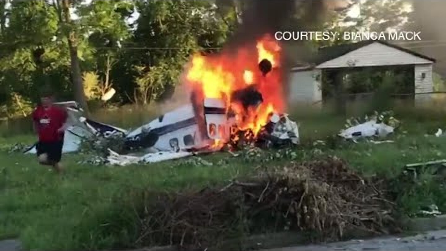 Video captures man crawling out of burning plane after crash
