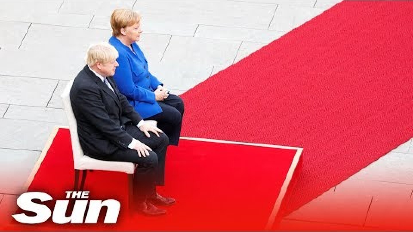 Boris Johnson given a military welcome in Germany by Angela Merkel