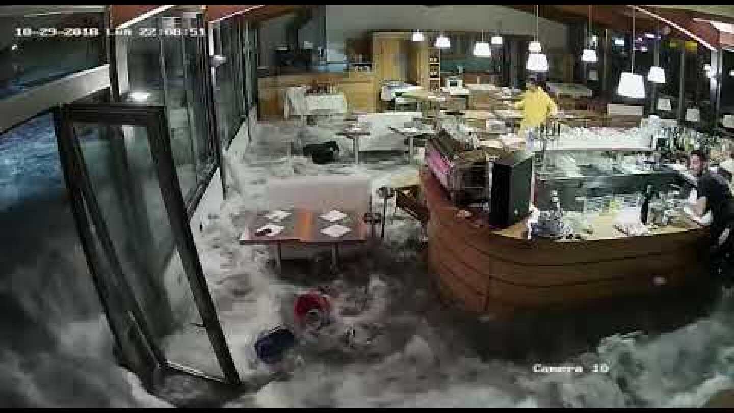 Wave Crashes Through Windows of Italian Restaurant