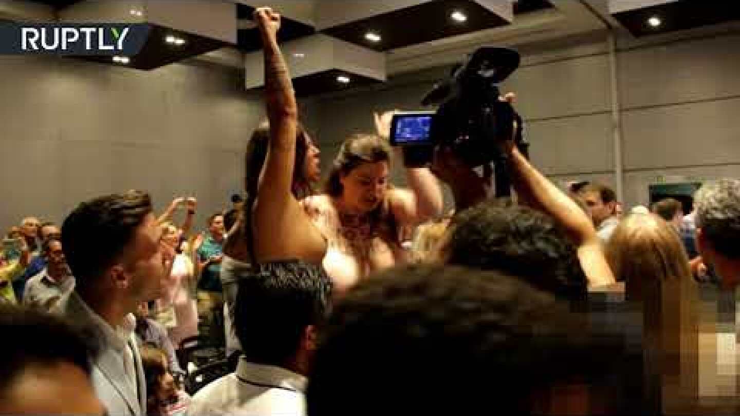 Topless FEMEN activists ambush Spanish pro-surrogacy politician